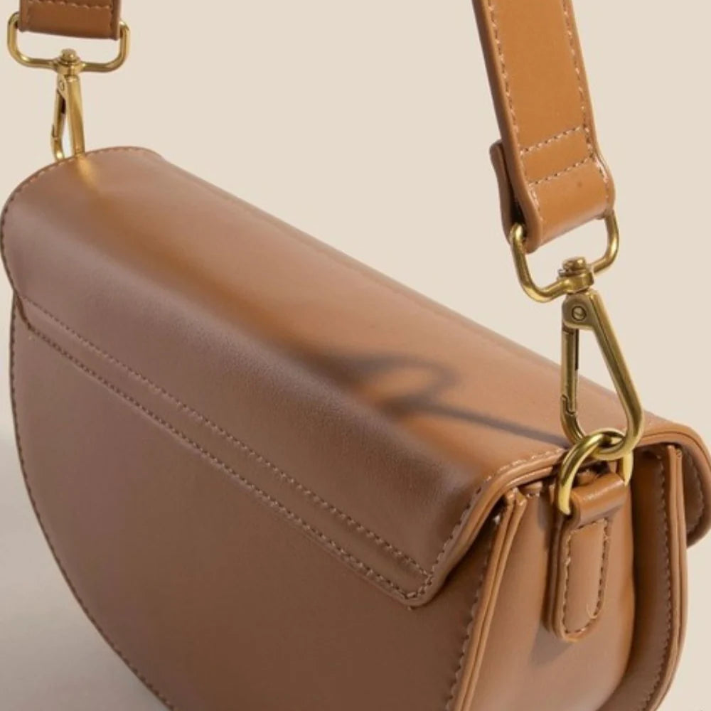 Buckle Half Moon Crossbody Bag by Madison West